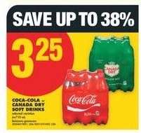 COCA-COLA or CANADA DRY SOFT DRINKS